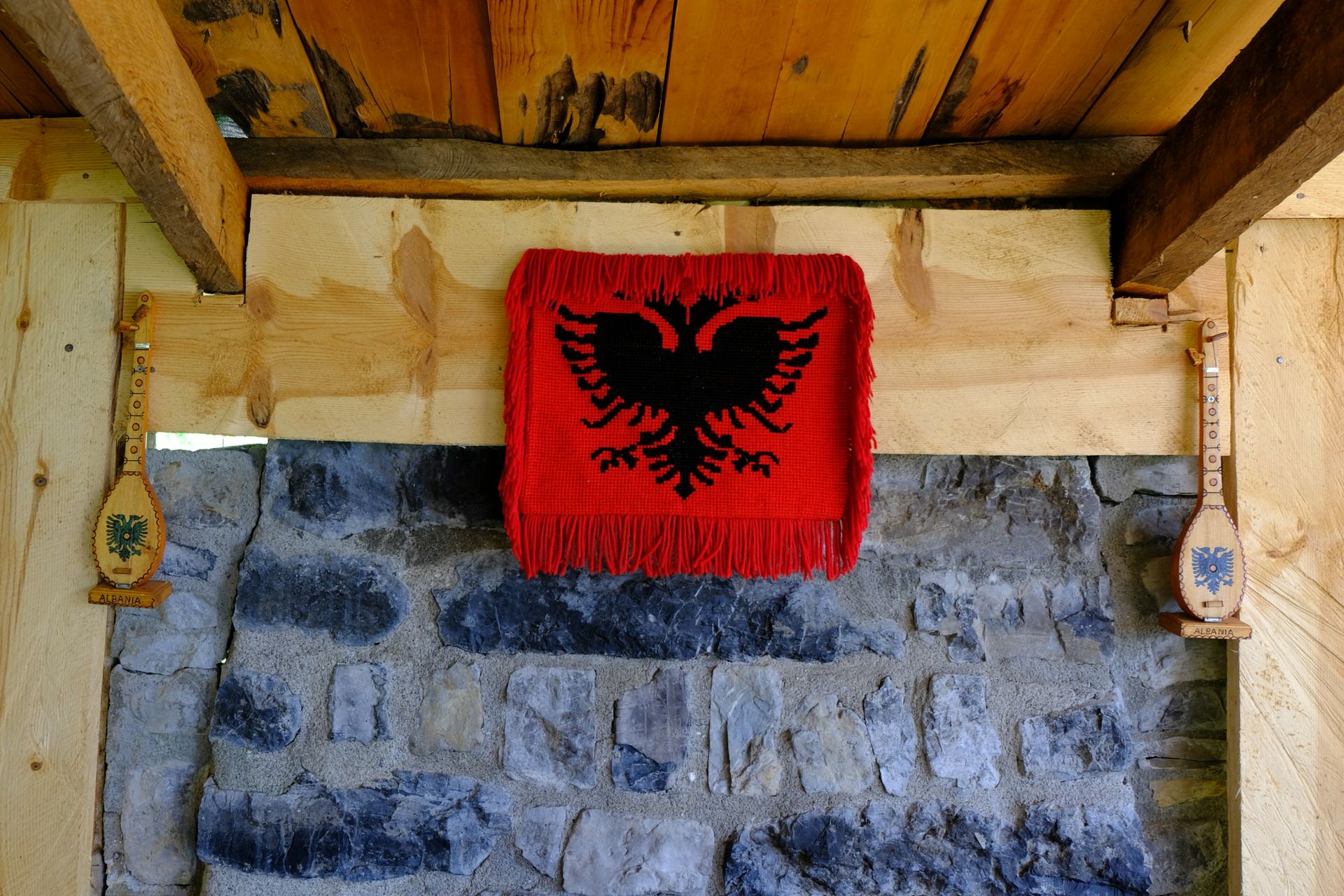 An Albanian flag on the wall of a mountain coffeehouse